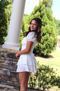 short white eyelet dress sweetheart neckline. ruffled hem.