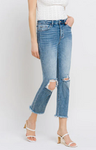 High rise waist, stretch, distressed, frayed hem, cropped length, slim fit, straight leg jeans 