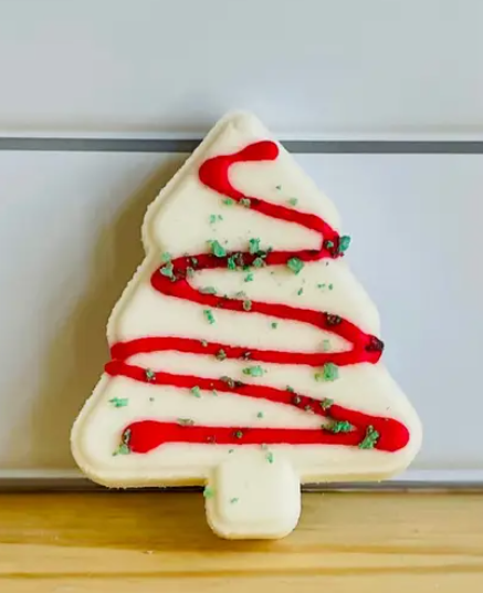 White Christmas Tree Cake Bath Bomb with red stripes