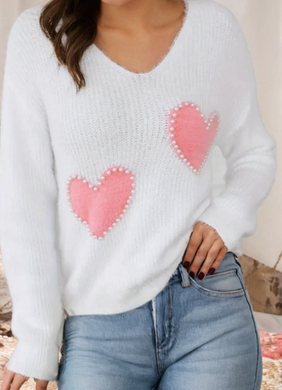 White sweater with pink hearts adorned with pearl outline 